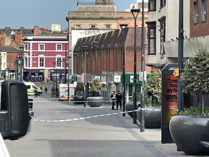Crime scene tape across a street in Derby, England.