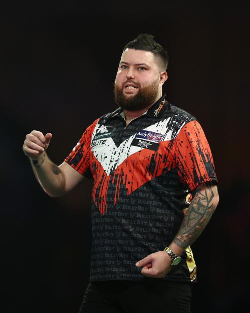 Michael Smith of England reacting during a darts match.