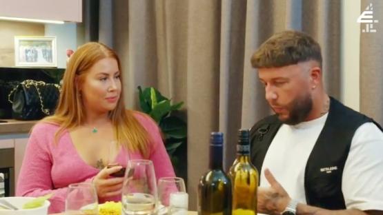 Polly and Adam at a dinner table.