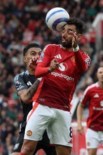 Bruno Fernandes of Manchester United heading the ball during a match.