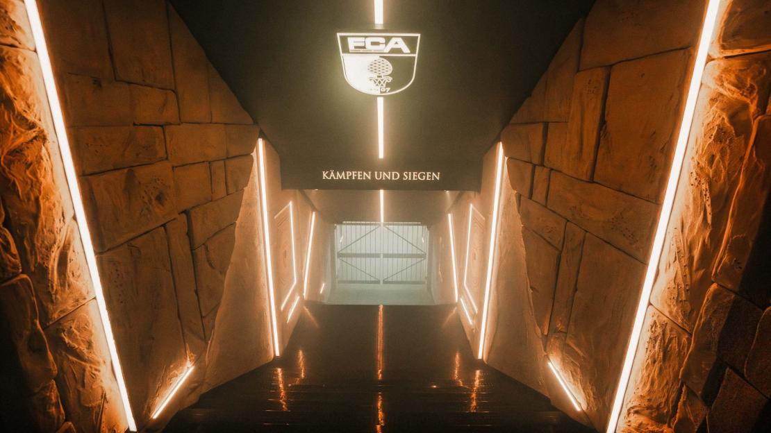 Roman-inspired stadium tunnel entrance.