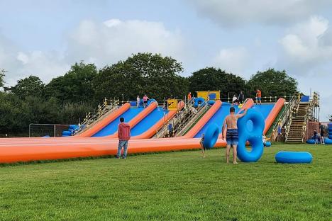 Our peaceful quiet village is ruined by huge 145m-long WATERSLIDE – it looks ridiculous and we hear screams all day long