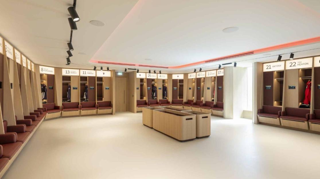 Refurbished Manchester United training ground locker room.