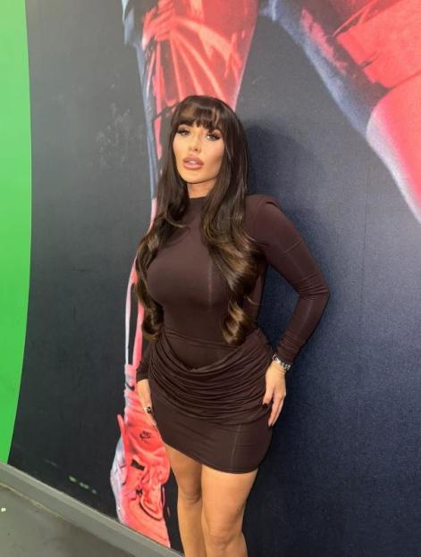 Chloe Brockett in a brown dress.