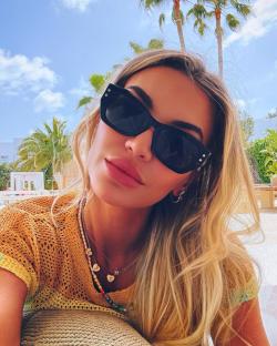 Woman wearing sunglasses outdoors.