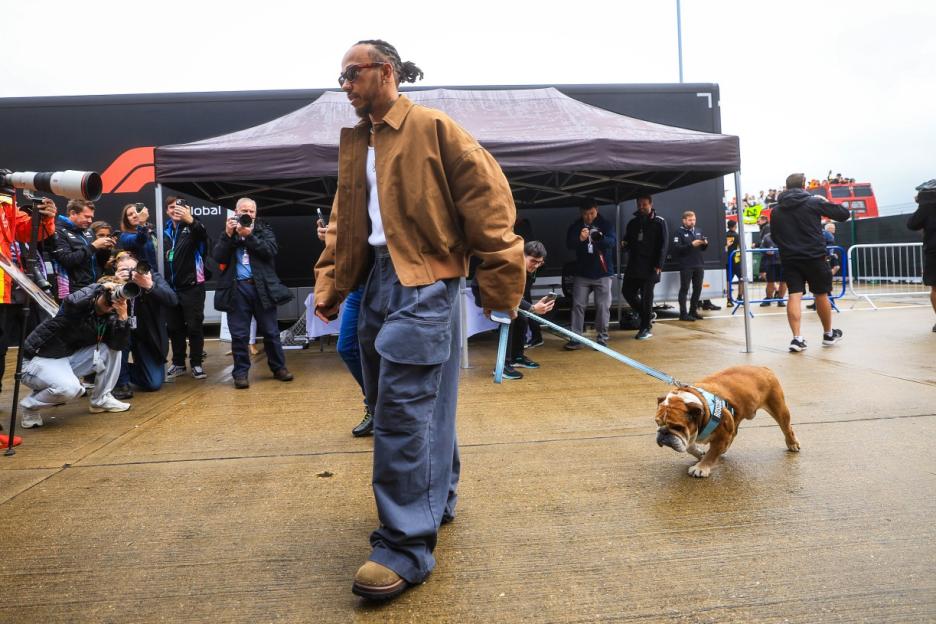 NORTHAMPTON, ENGLAND - JULY 5: Lewis Hamilton of Great Britain and Mercedes arrives in the paddock with his dog Roscoe during practice ahead of the F1 Grand Prix of Great Britain at Silverstone Circuit on July 5, 2024 in Northampton, United Kingdom. (Photo by Kym Illman/Getty Images)