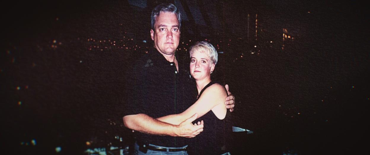 Photo of Amy Bradley and a man embracing.