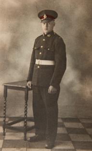 Photo of Tom Hill, a 99-year-old landing craft coxswain, in uniform.