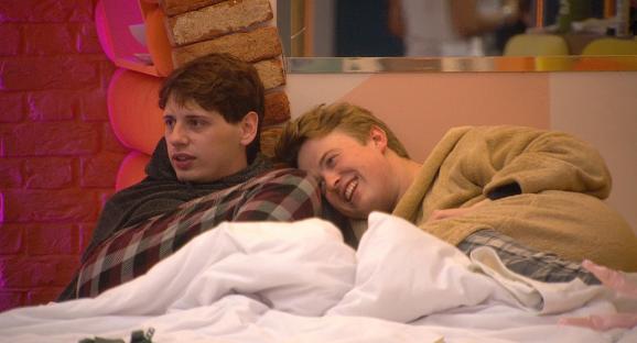 Jordan and Henry, contestants on Big Brother, lying in bed.