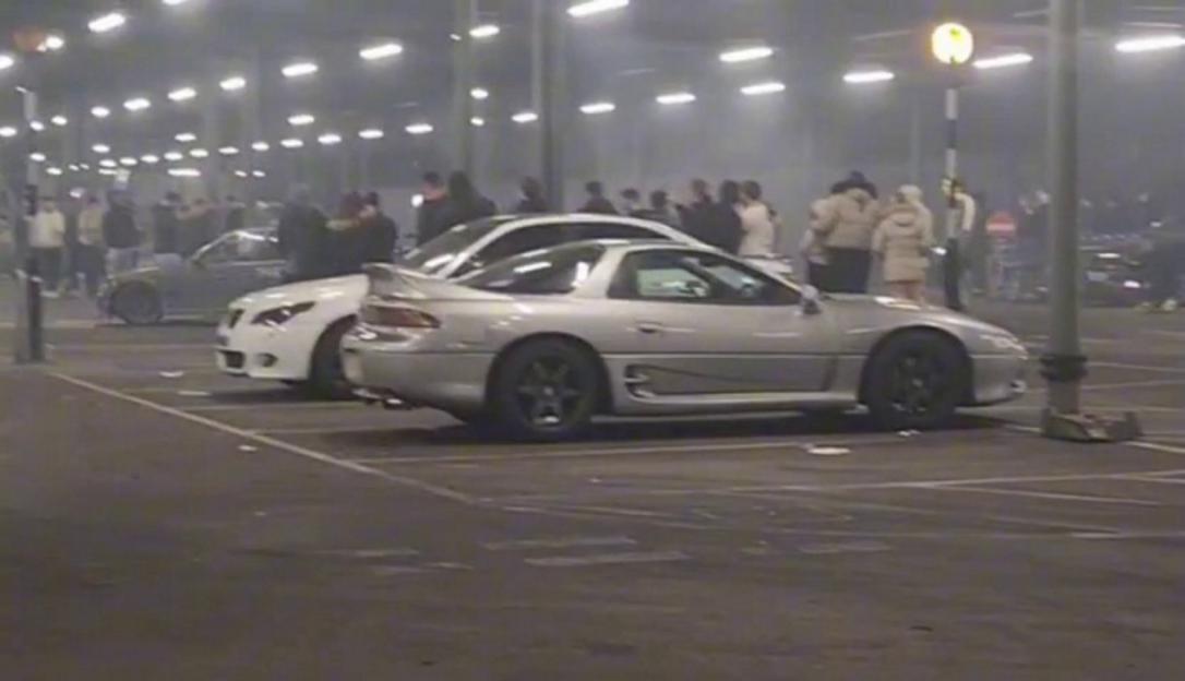 Cars drifting at Tesco superstore's car park in Elmer's End. / Locals in a south London suburb are calling for an end to "dangerous" car drifting in a supermarket car park - which they say has kept them and their children awake for years. Residents in Elmers End say petrolheads using a Tesco superstore's car park keeps them up at night and lowers their quality of life. Videos of a recent car meet show crowds of people having to dodge out of the way as screeching cars drift around the car park. Liam Conlon, the Labour MP for the area, says so many of his constituents have written to him about the issue that he started a petition calling for action. Photo released 23/09/2025
