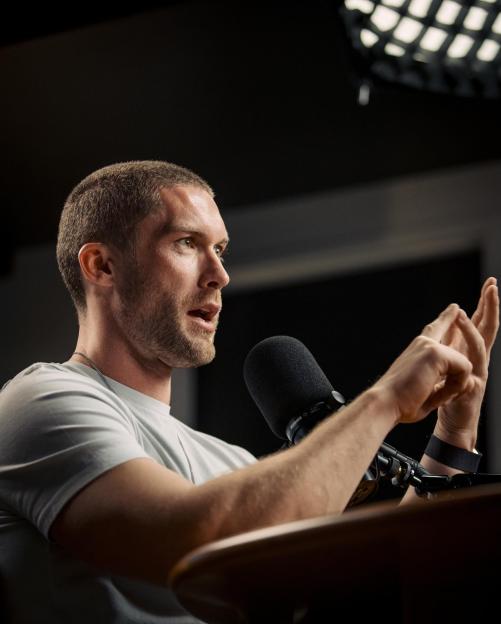 Man speaking into a microphone.
