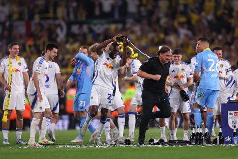 Leeds United players celebrating promotion to the Premier League.