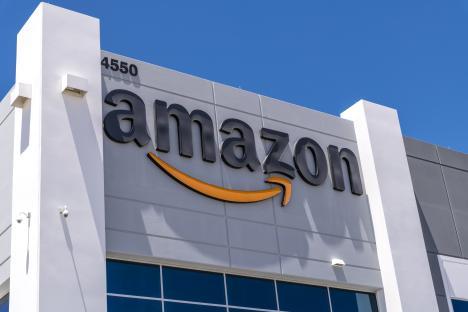 Amazon logo on a fulfillment center building.