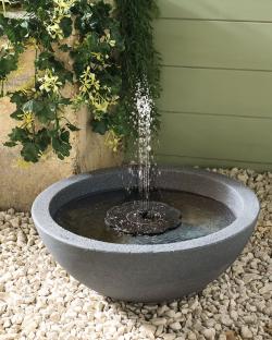 Solar-powered fountain in a gray bowl.
