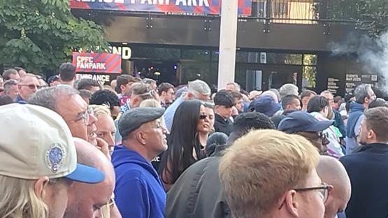 Maya Jama in a crowd of people leaving Wembley Stadium.