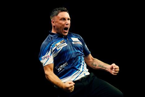 Gerwyn Price reacting during a darts match.