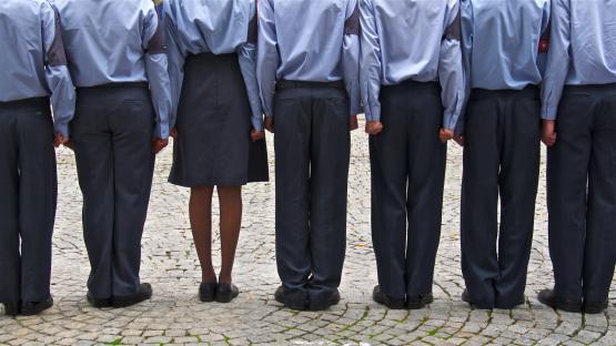 Backs of British air force cadets in uniform.