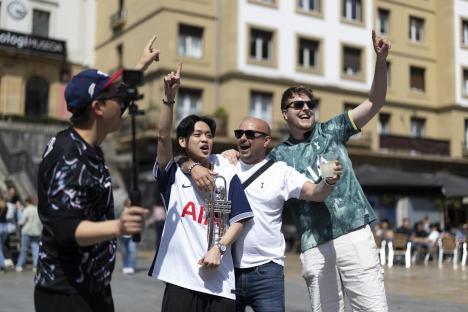 Tottenham Hotspur fans celebrating with a trumpet.