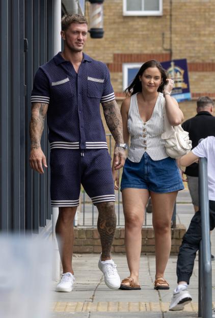 Dan Osborne and Jacqueline Jossa walking together.