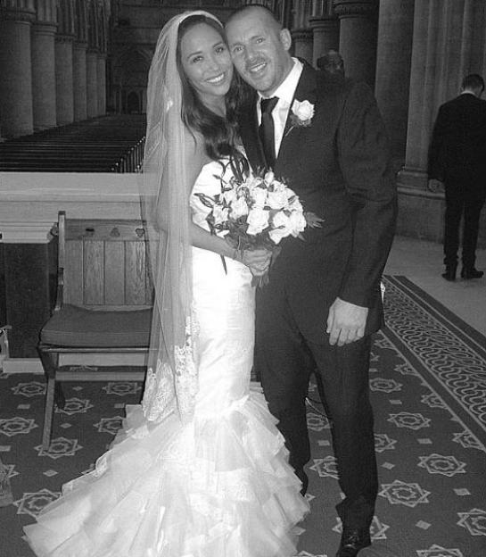 Black and white photo of Myleene Klass and Graham Quinn on their wedding day.
