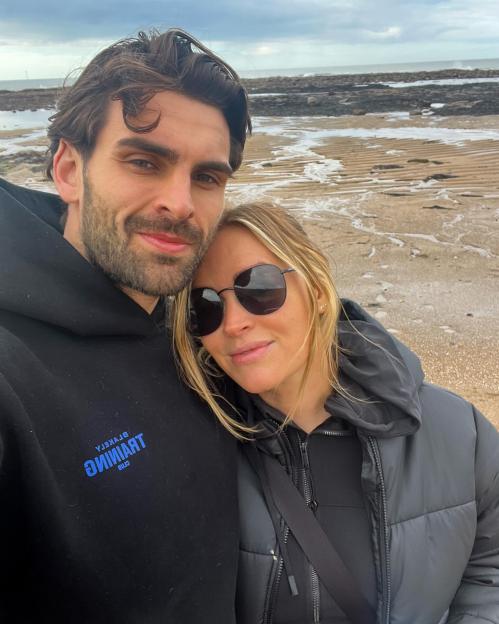 Laura Woods and Adam Collard in a selfie at the beach.