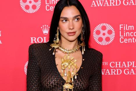 Dua Lipa flashes her thong as she goes braless in sheer dress as she arrives at celeb event in New York