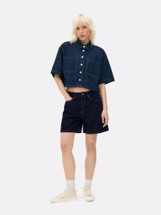 Model wearing denim Bermuda shorts and a denim shirt.
