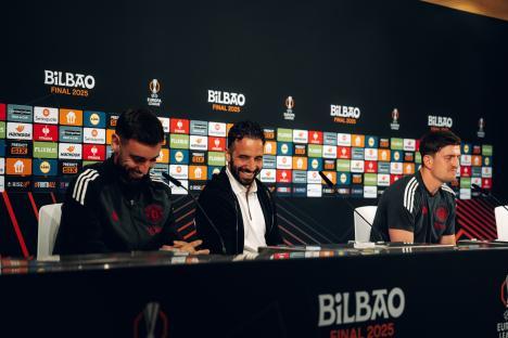 Ruben Amorim and Manchester United staff at a press conference.