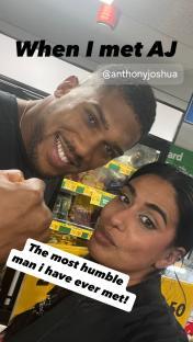 Anthony Joshua and a woman posing for a selfie.
