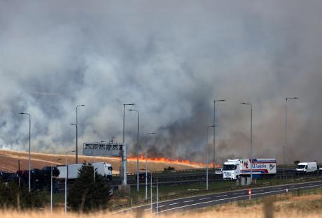Major roads CLOSED as firefighters battle moors blaze STILL raging near motorway as thousands of drivers urged stay away