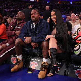 Stefon Diggs and Cardi B at an NBA game.