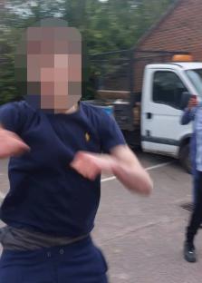 A person's face is blurred in this photo of a person running away.