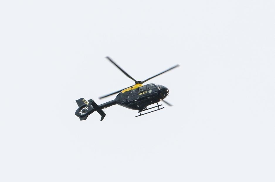 Helicopter spraying crops.