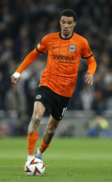 Hugo Ekitike of Eintracht Frankfurt dribbling the ball during a soccer match.