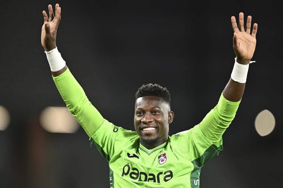 Trabzonspor goalkeeper Andre Onana greets fans.