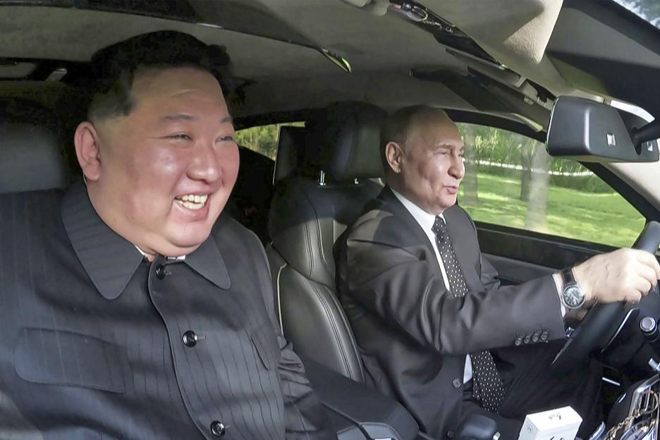 Kim Jong Un and Vladimir Putin in a car.