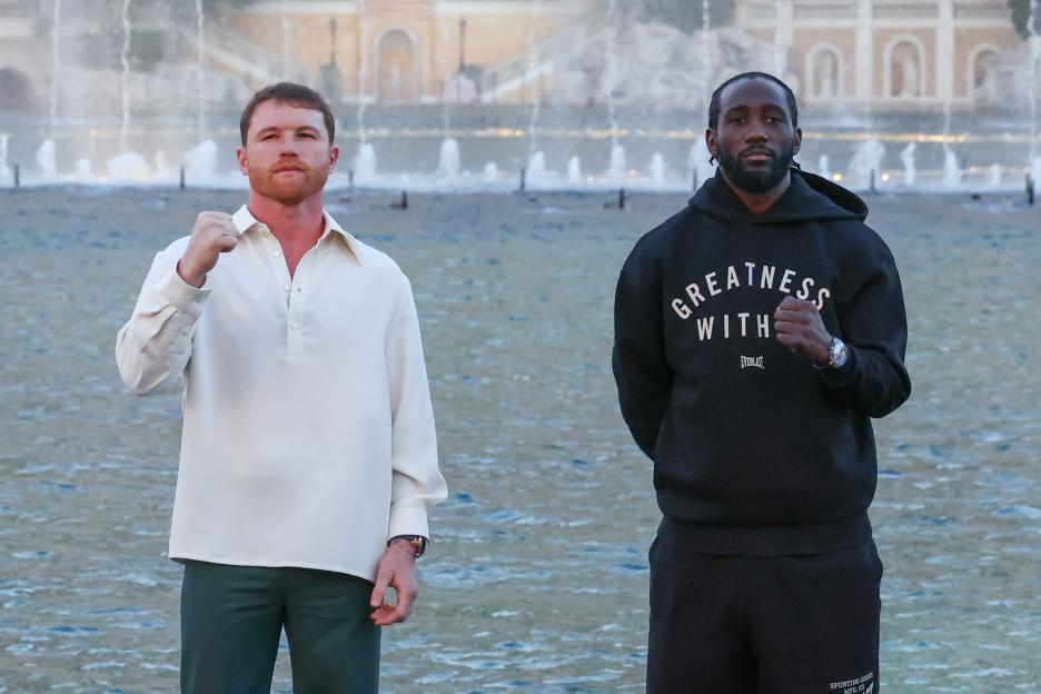 Canelo Alvarez and Terence Crawford posing together.