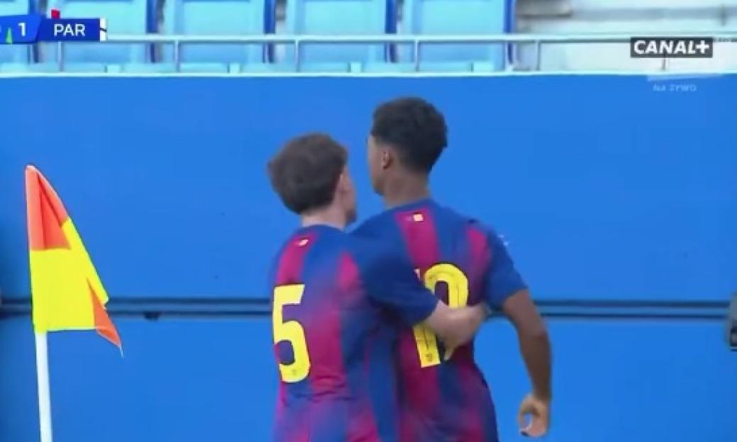 Two soccer players in blue and red striped jerseys, number 5 and number 10, celebrating a goal.