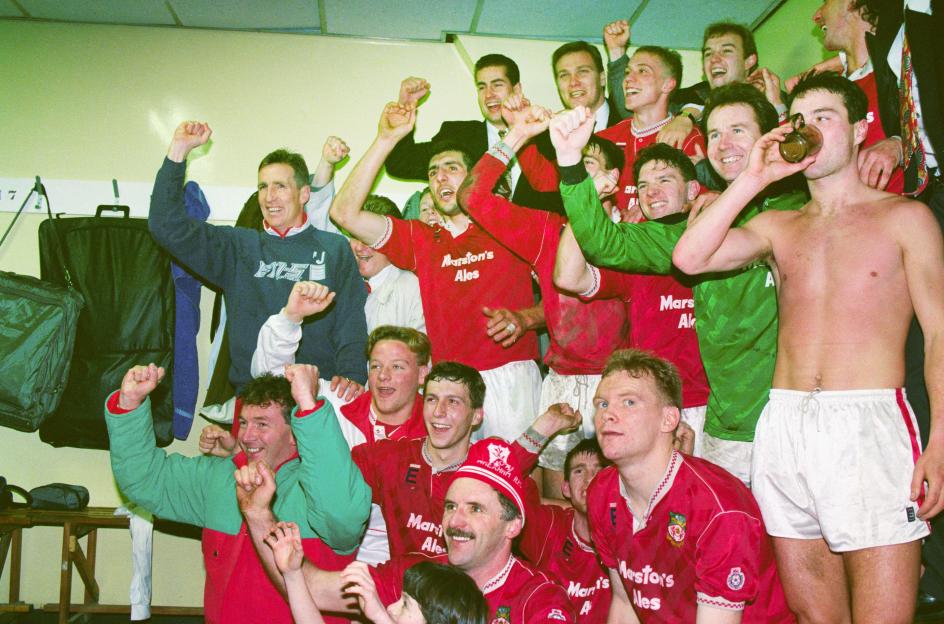 Wrexham soccer players celebrating in the locker room after a FA Cup victory.