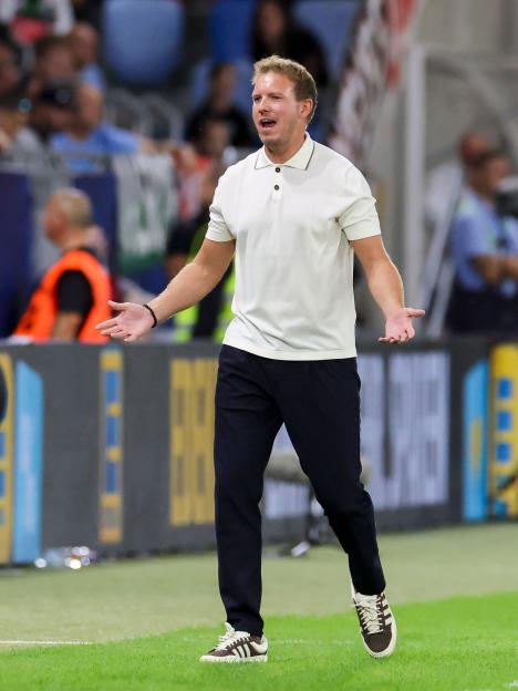 Julian Nagelsmann looking dejected on the soccer field.