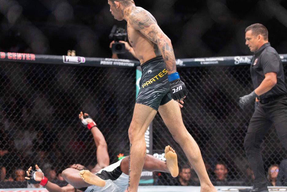 Carlos Prates knocks down Geoff Neal in a UFC welterweight bout.