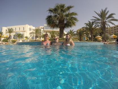 Three women in a resort pool.