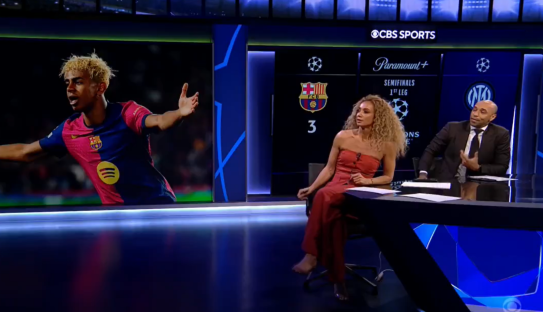 Two sportscasters discussing a soccer game featuring a Barcelona player.