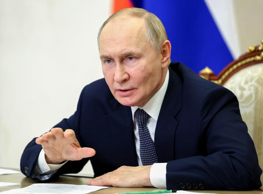Russian President Vladimir Putin speaks at a meeting via videoconference.