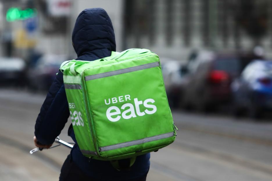 Uber Eats delivery bag on a courier's back.