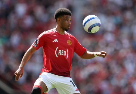 Manchester United's Amad Diallo playing soccer.