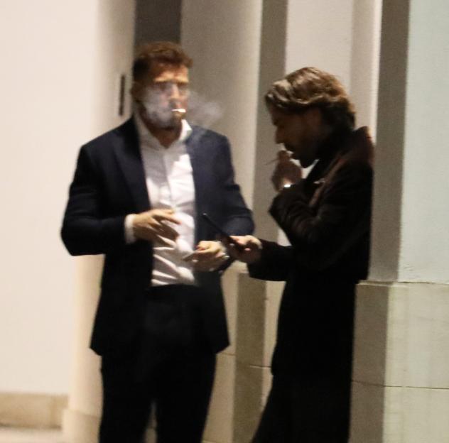 Pete Wicks and Sam Thompson chatting and smoking outside the Pride of Britain after-party.