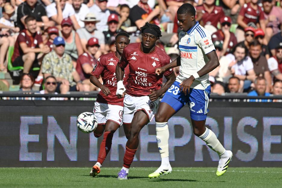 Soccer players vying for the ball during a match.