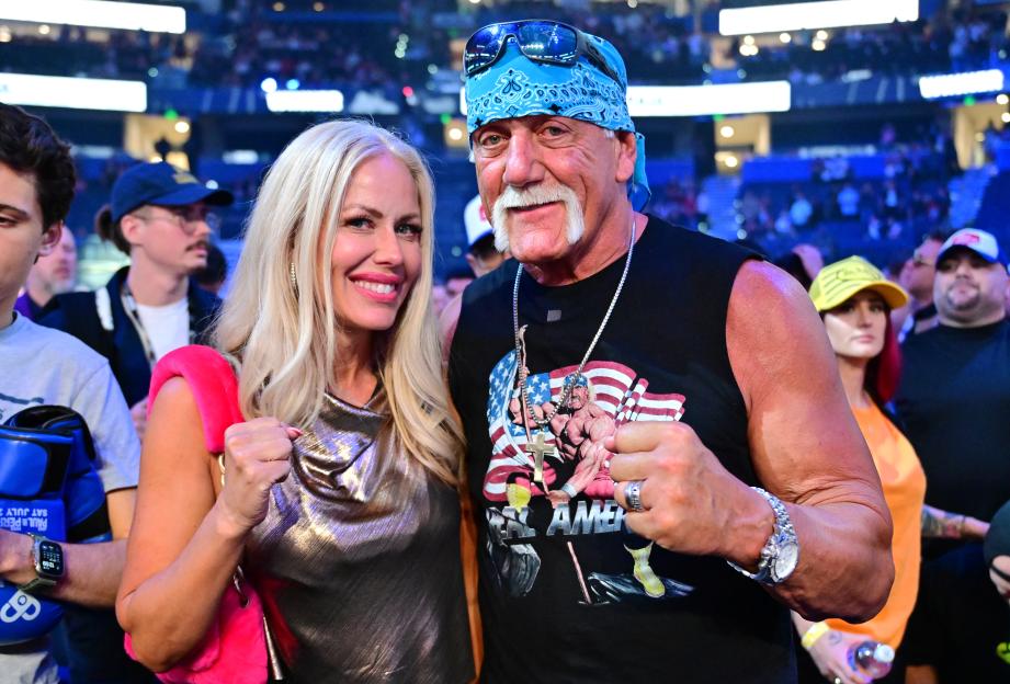 Hulk Hogan and his wife, Sky Daily, posing for a photo.