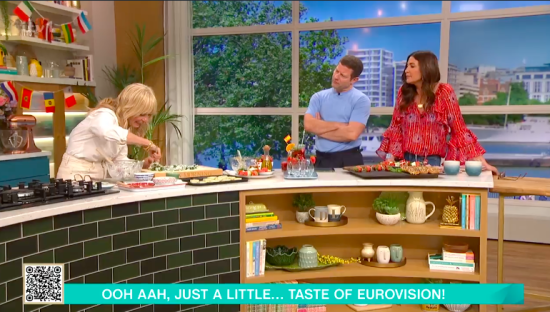 Screenshot of three people on a cooking show preparing food representing Eurovision.